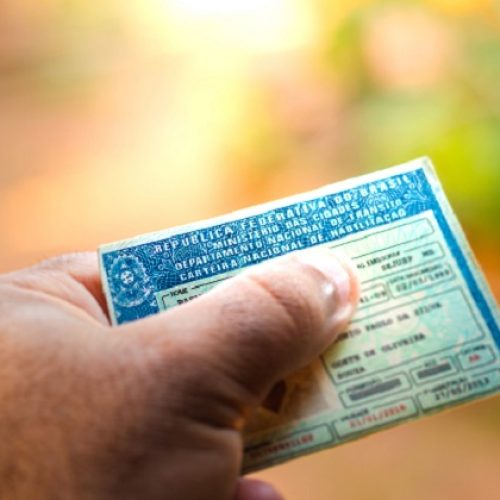 August 28, 2019, Brazil. Man holding document "Carteira Nacional de Habilitação" (CNH). A driver's license attests to a citizen's ability to drive land motor vehicles.